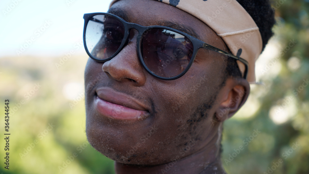 Portrait of african american male standing outdoors along the beach Portrait of african american male standing outdoors along the beach