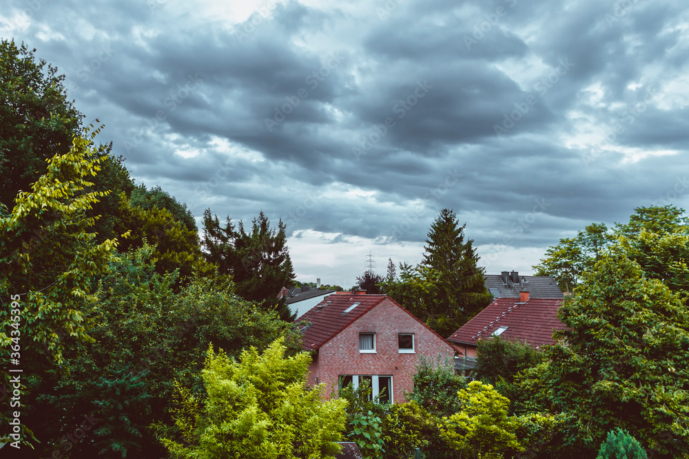 Modern german houses against dramatic sky