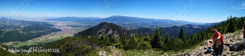 Mountain landscape in the summer with blue sky - panormic view - hiker resting