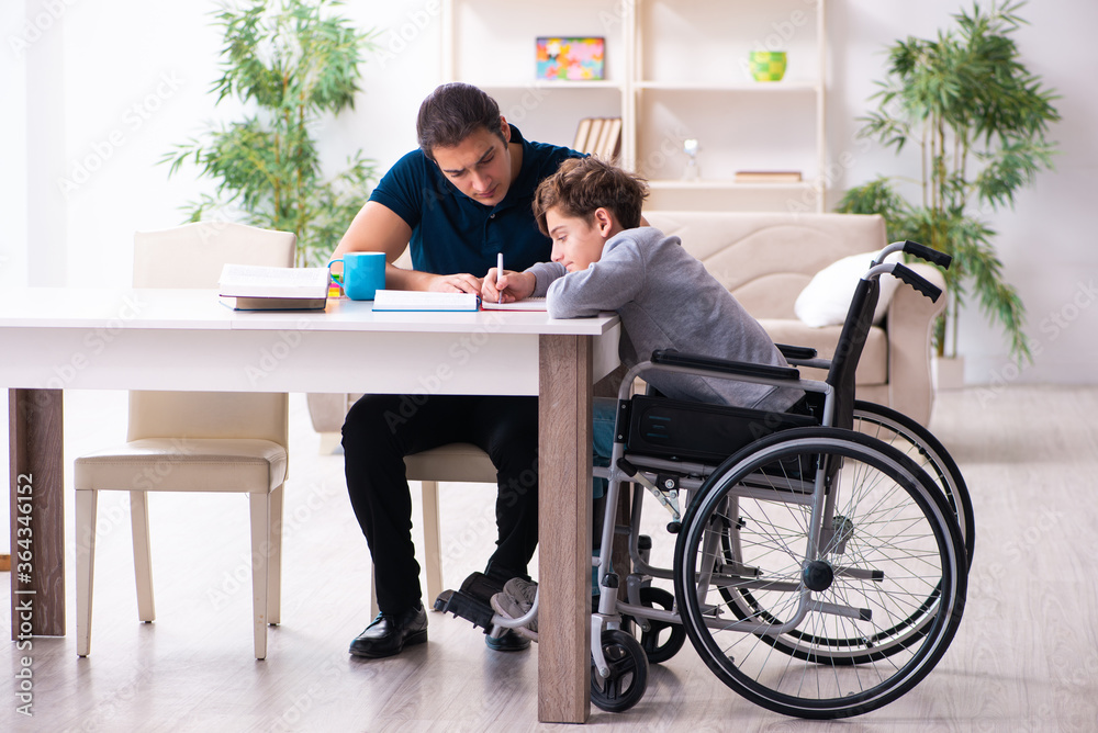 Father and disabled son in education concept Father and disabled son in education concept