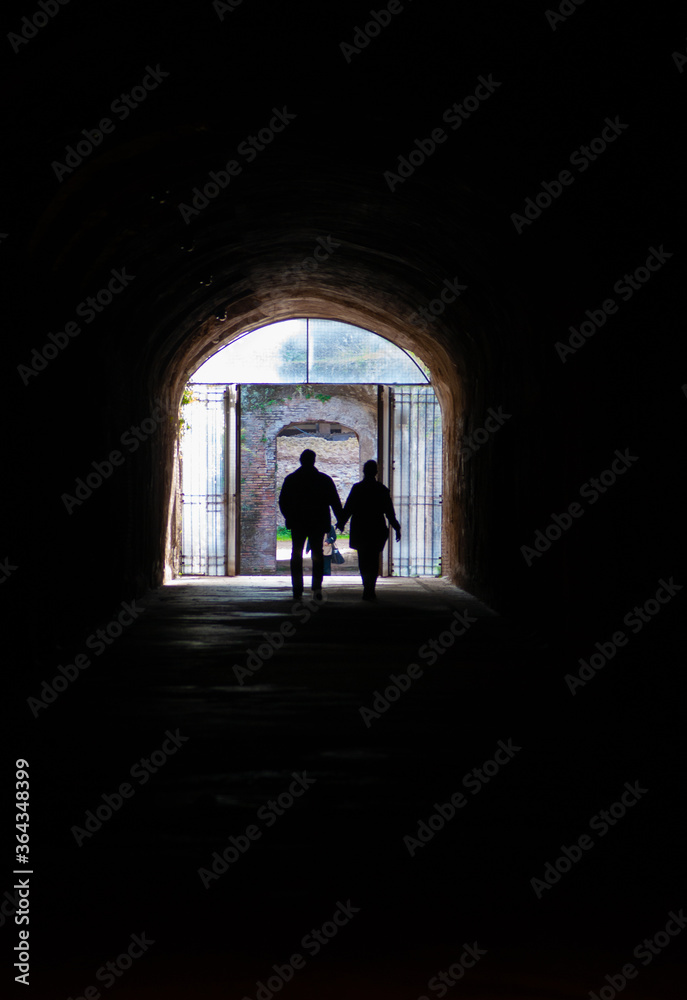 Two People in a Dark Tunnel