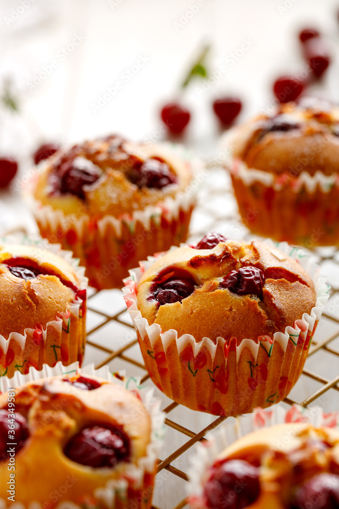 Homemade cherry muffins on a cooling tray close-up view Homemade cherry muffins on a cooling tray close-up view