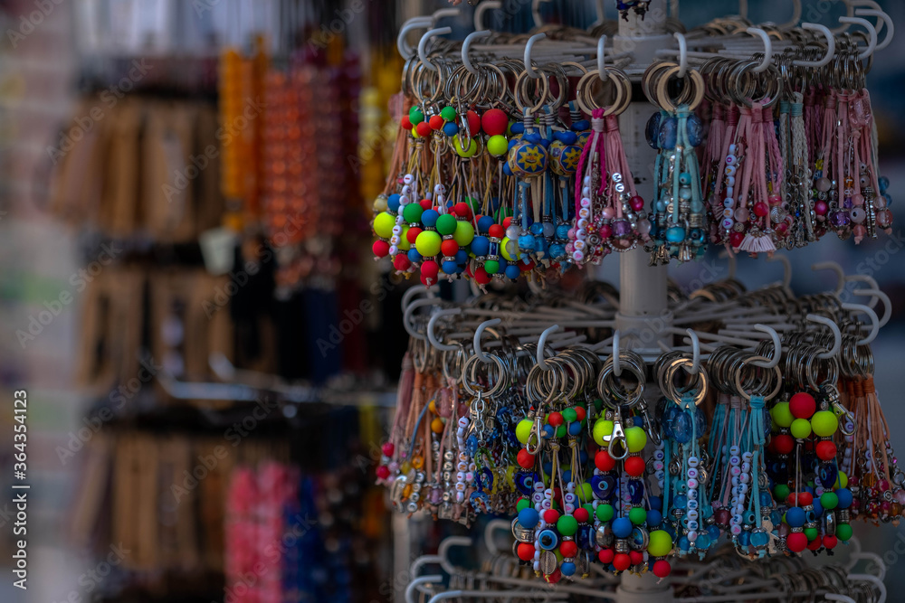 Many various colorful keychains. Keychain collection, Souvenir key rings with the symbols in the gift shop. Ioannina Epirus Greece