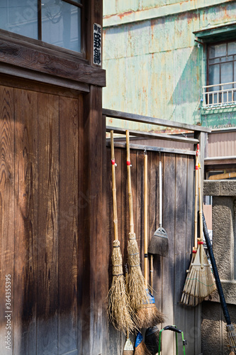 Straw Brooms on Fence at Shitaya Jinja Shinto Shrine