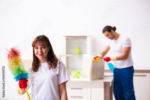 Young pair doing housework at home