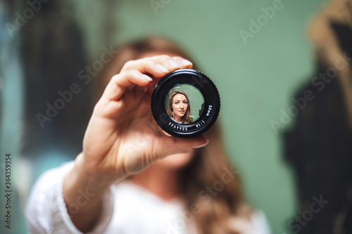 portrait of woman looking searching through lense