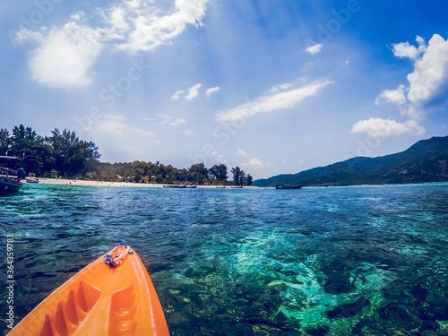  kayaking in crystal clear tropical waters - kayak heading to isolated beach in Ko Tarutao national park © Melinda Nagy