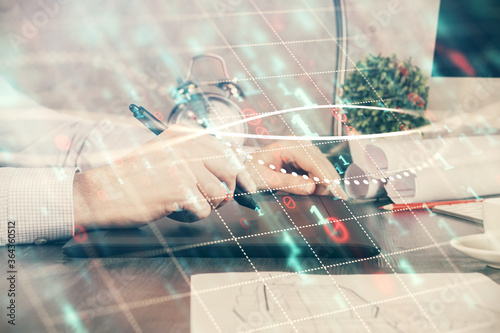 Wallpaper Mural Double exposure of man's hands holding and using a phone and financial graph drawing. Analysis concept. Torontodigital.ca