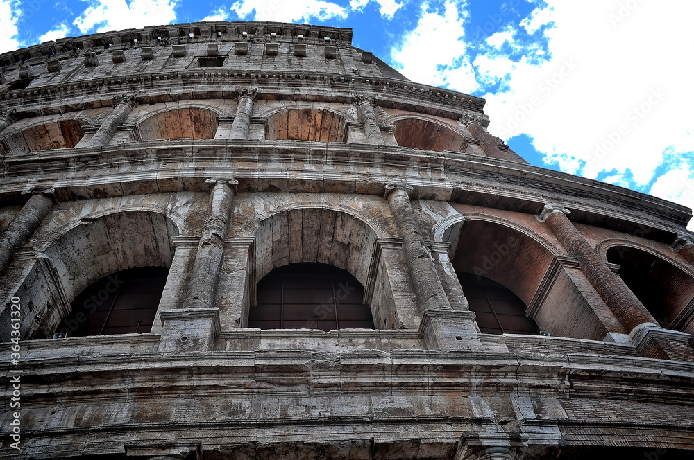 The Colosseum in Rome, Italy under a beautiful blue sky