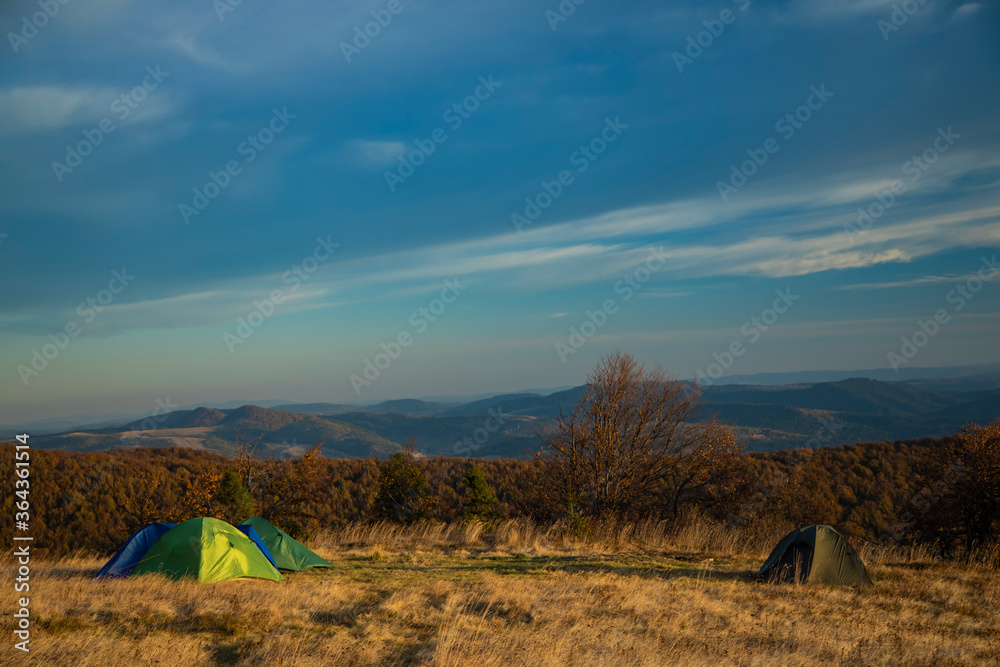travel life style landscape of tent camp side on highland meadow mountain forest nature scenery environment of autumn September season