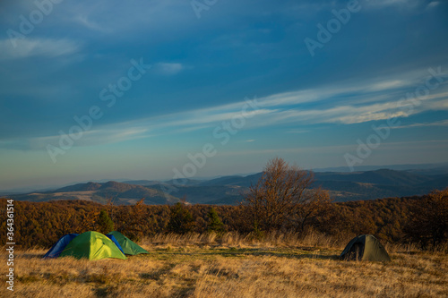 travel life style landscape of tent camp side on highland meadow mountain forest nature scenery environment of autumn September season