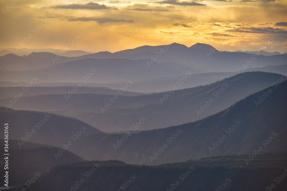 Sunset at the midnight dome above Dawson City overlooking the Yukon River in northern Canada. Taken in the summer time. Sunset at the midnight dome above Dawson City overlooking the Yukon River in northern Canada. Taken in the summer time.