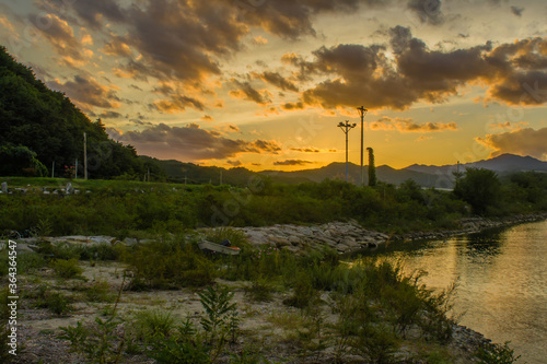 Landscape of beautiful sunset over inlet shore