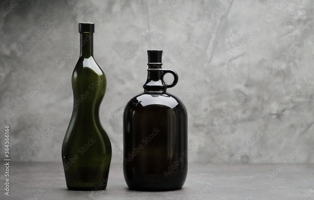 Wine bottle on a concrete background. Free space for inscription Fitness concept