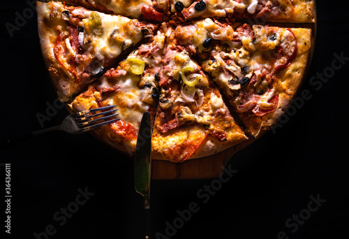 pizza for advertising. table setting. background black Pizza on the table.