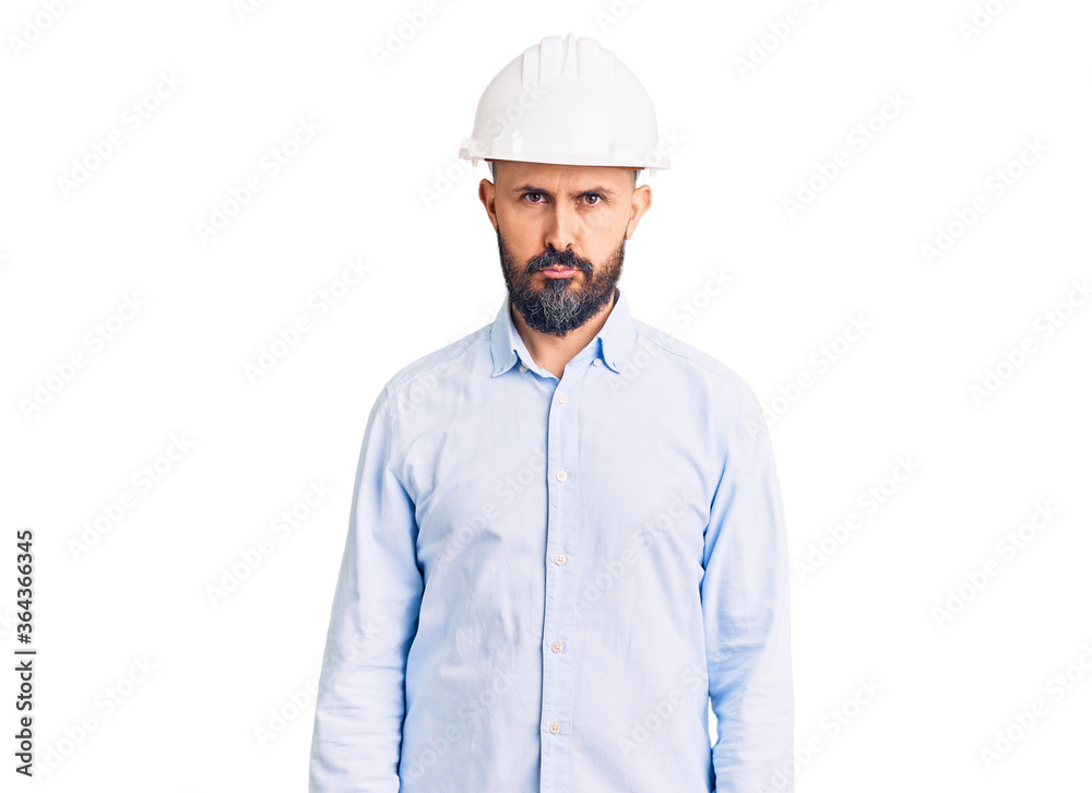 Young handsome man wearing architect hardhat depressed and worry for distress, crying angry and afraid. sad expression. Young handsome man wearing architect hardhat depressed and worry for distress, crying angry and afraid. sad expression.