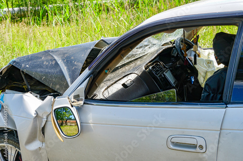 Komsomolsk, Russia - July 12, 2020: a Japanese passenger car after an accident, an activated airbag, a crumpled hood, body damage
 photo