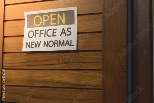 Label for open office. The concept is opening office after the COVID-19 situation, follows the new normal life. select tive focus