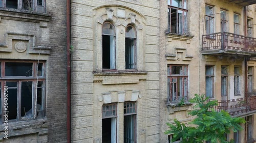 Wallpaper Mural Abandoned old commercial apartment building in the Art Nouveau style (Modern Style) with a broken windows. Deserted early 20th century house. Aerial side view Torontodigital.ca