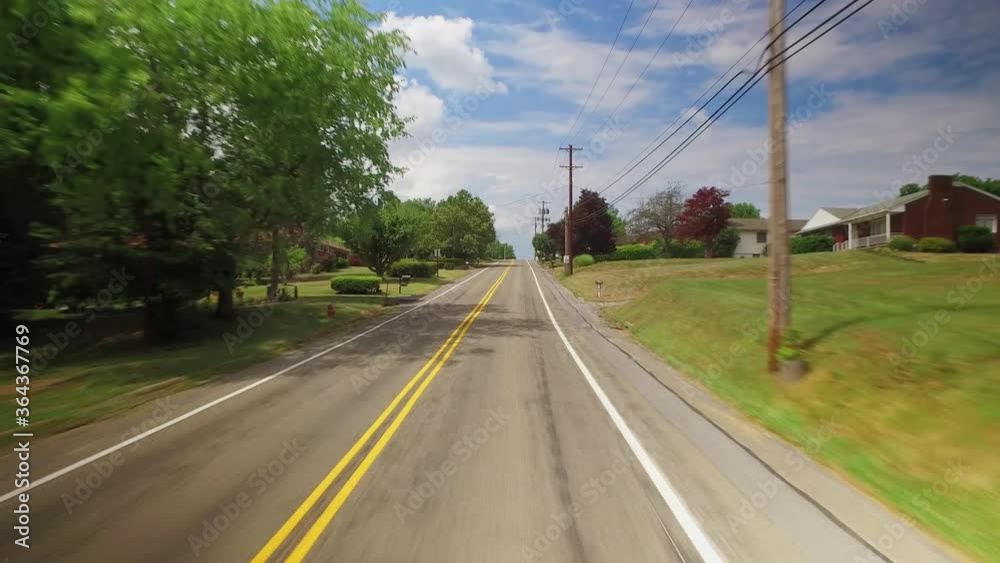 A forward driving view in the Pennsylvania countryside. Various homes and farmlands pass by. Pittsburgh suburbs. Part 2 of 3. A forward driving view in the Pennsylvania countryside. Various homes and farmlands pass by. Pittsburgh suburbs. Part 2 of 3.