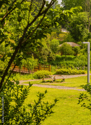 Picnic table in front of wooden footbridge