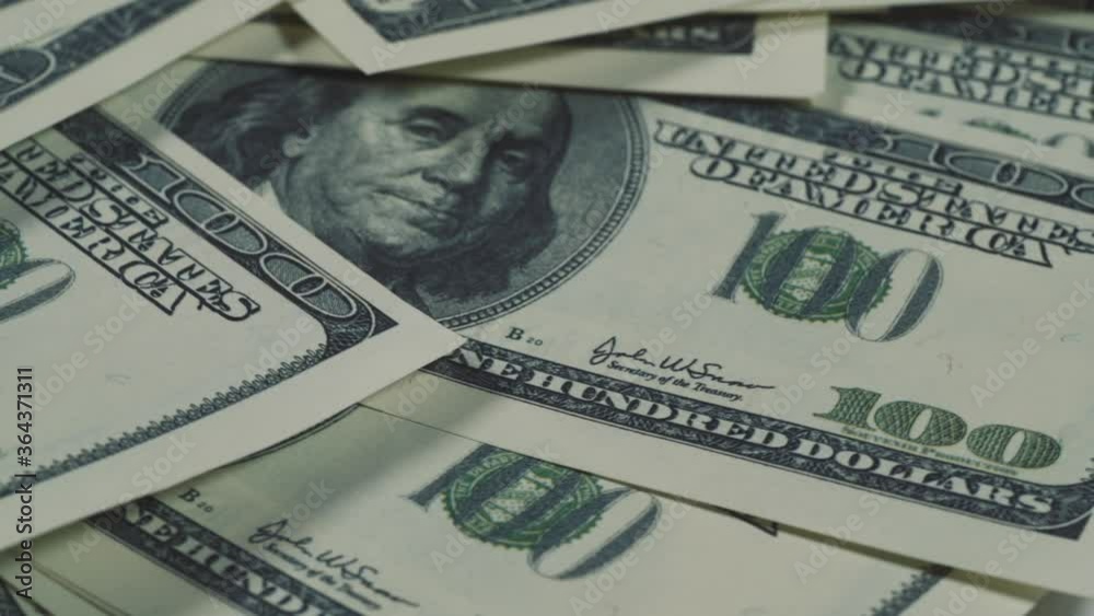 Hundred Dollar Bills Banknotes, macro shot. Rotation of American cash money Hundred Dollar Bills Banknotes, macro shot. Rotation of American cash money