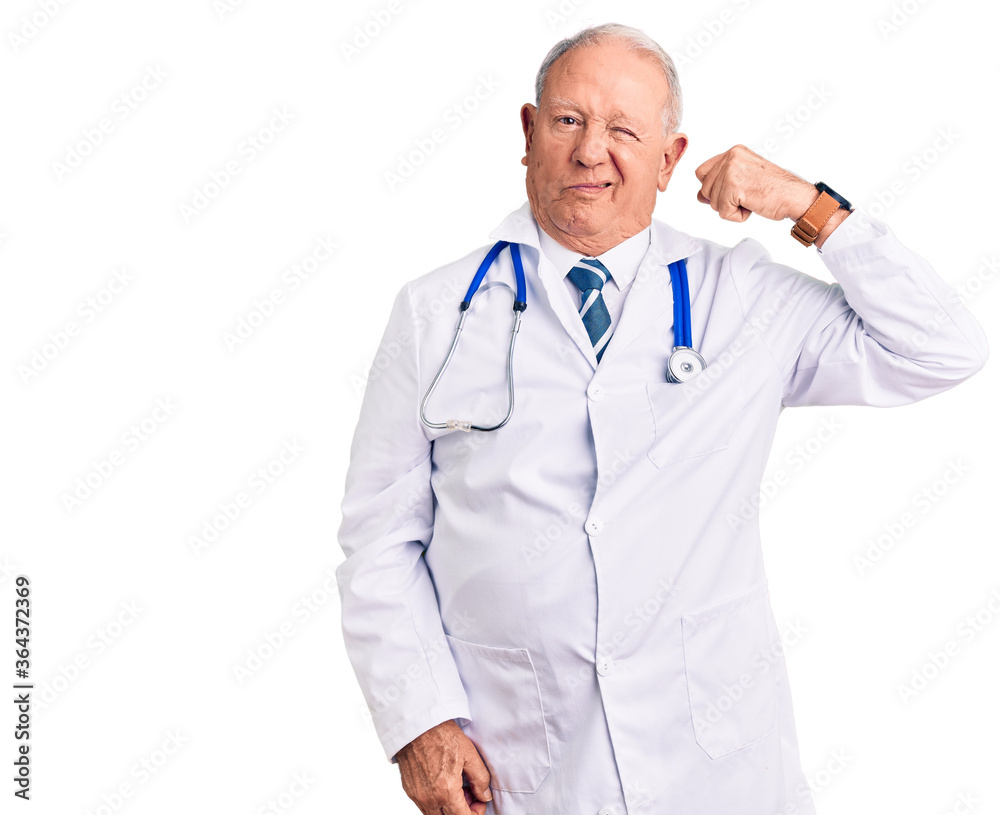 Senior handsome grey-haired man wearing doctor coat and stethoscope strong person showing arm muscle, confident and proud of power Senior handsome grey-haired man wearing doctor coat and stethoscope strong person showing arm muscle, confident and proud of power