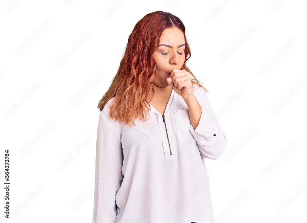 Young latin woman wearing casual clothes feeling unwell and coughing as symptom for cold or bronchitis. health care concept. Young latin woman wearing casual clothes feeling unwell and coughing as symptom for cold or bronchitis. health care concept.