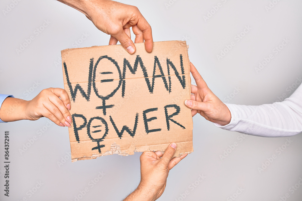 Hands of caucasian people asking for women rights holding banner with woman power message over isolated white background Hands of caucasian people asking for women rights holding banner with woman power message over isolated white background