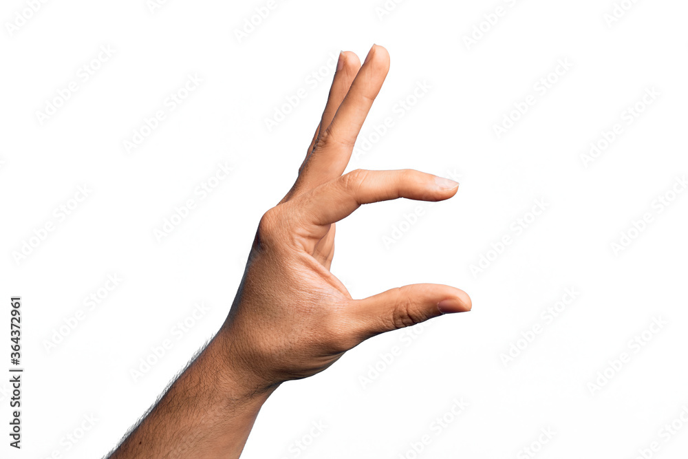 Hand of caucasian young man showing fingers over isolated white background picking and taking invisible thing, holding object with fingers showing space Hand of caucasian young man showing fingers over isolated white background picking and taking invisible thing, holding object with fingers showing space