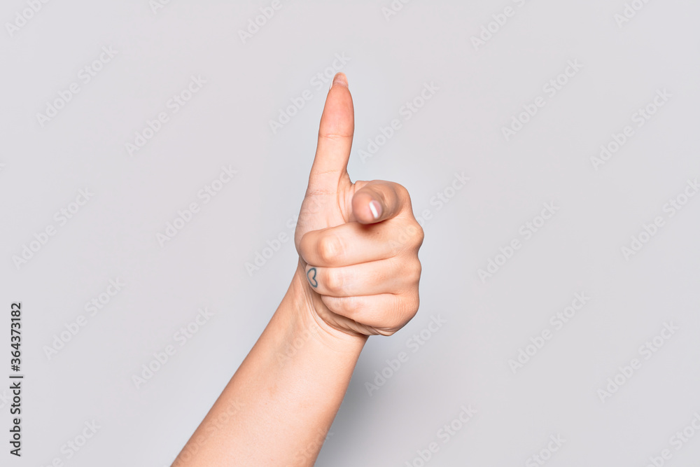 Hand of caucasian young woman pointing forefinger to the camera, choosing and indicating towards direction Hand of caucasian young woman pointing forefinger to the camera, choosing and indicating towards direction