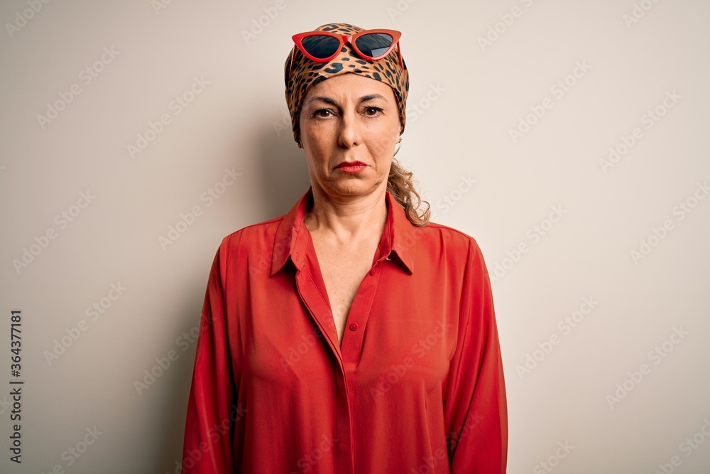 Middle age brunette woman wearing handkerchief on head and shirt over white background depressed and worry for distress, crying angry and afraid. Sad expression. Middle age brunette woman wearing handkerchief on head and shirt over white background depressed and worry for distress, crying angry and afraid. Sad expression.