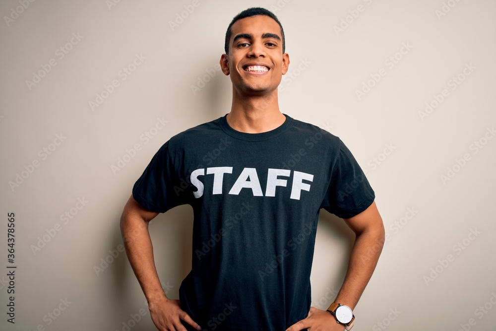 Young handsome african american worker man wearing staff uniform over white background with a happy and cool smile on face. Lucky person.