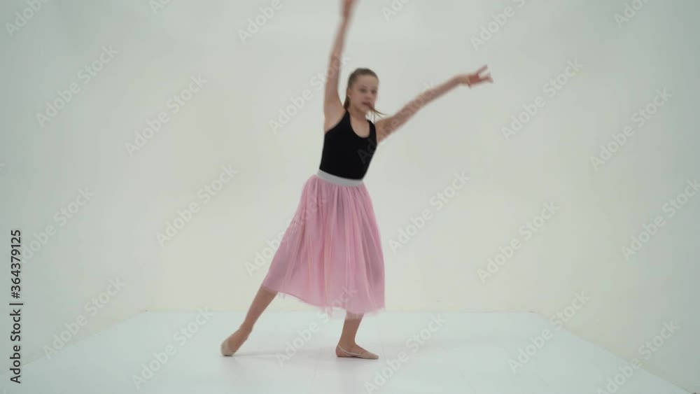 Graceful Girl Gymnast Performing Rhythmic Gymnastics Exercise. Graceful Girl Gymnast Performing Rhythmic Gymnastics Exercise.