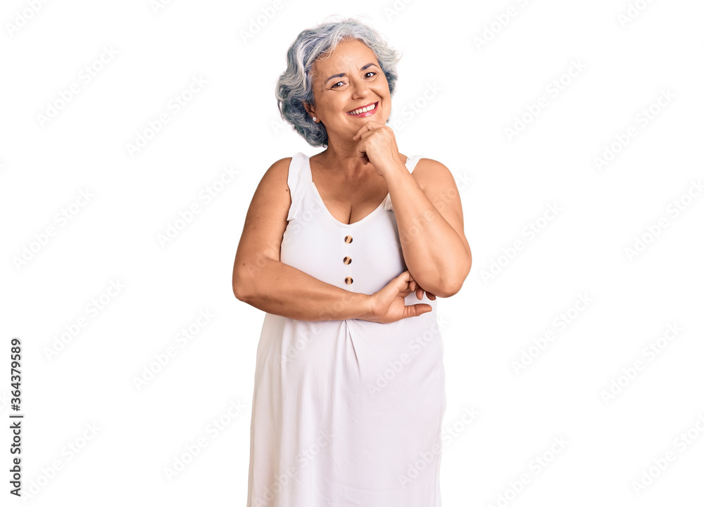 Senior woman with gray hair wearing casual clothes looking confident at the camera with smile with crossed arms and hand raised on chin. thinking positive. Senior woman with gray hair wearing casual clothes looking confident at the camera with smile with crossed arms and hand raised on chin. thinking positive.