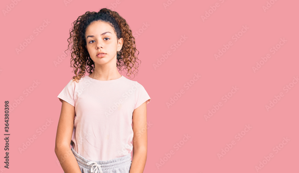 Φωτογραφία Beautiful kid girl with curly hair wearing casual clothes relaxed with serious expression on face