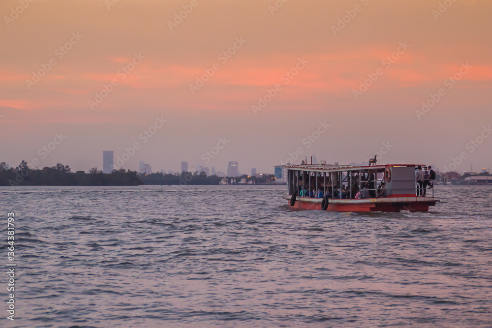 Obraz premium The public ferry service during across Choa Phraya River. Samut Prakan is at the mouth of the Chao Phraya River on the Gulf of Thailand.