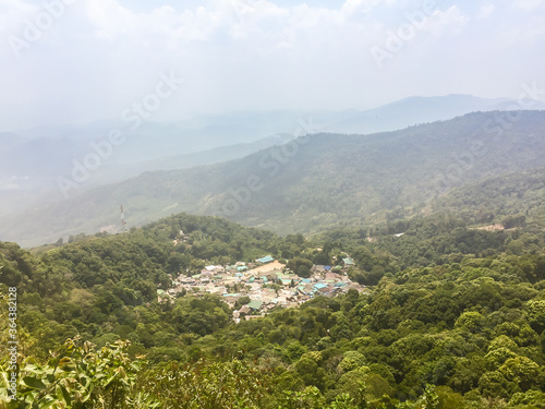 Panorama view of Doi Pui   s Hmong ethnic hill-tribe village  aerial view green forest on the mountain background. Doi Pui Hmong tribal village is located on Doi Suthep-Pui national park  Chiang Mai.