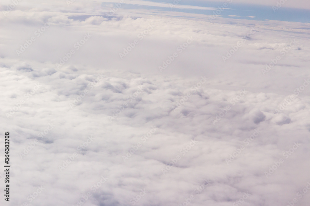 Beautiful cloudscape and blue sky from aerial view, nature view from above the sky and clouds. White clouds and blue sky view like the heaven from airplane window. Sunlight in the sky shines on clouds Beautiful cloudscape and blue sky from aerial view, nature view from above the sky and clouds. White clouds and blue sky view like the heaven from airplane window. Sunlight in the sky shines on clouds