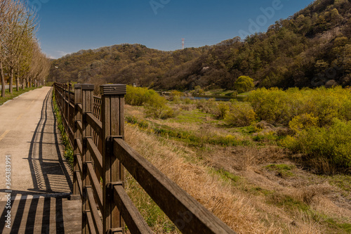 Bicycle trail in wilderness river valley..