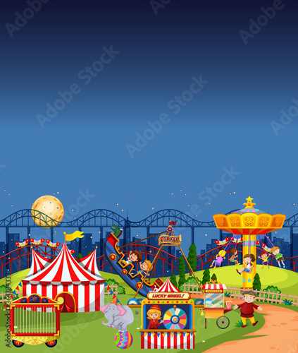 Amusement park scene at night with blank dark blue sky