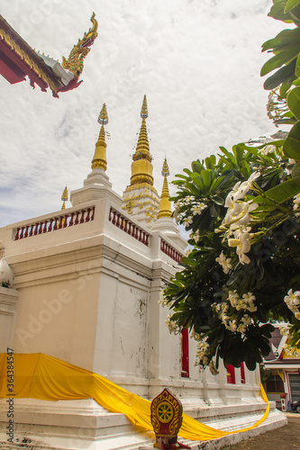 Beautiful landscape and white gold pagoda of Wat Jedyod, Chiang Rai, Thailand. Wat Chet Yot is a temple that has been renovated from the remains of an ancient temple. photo