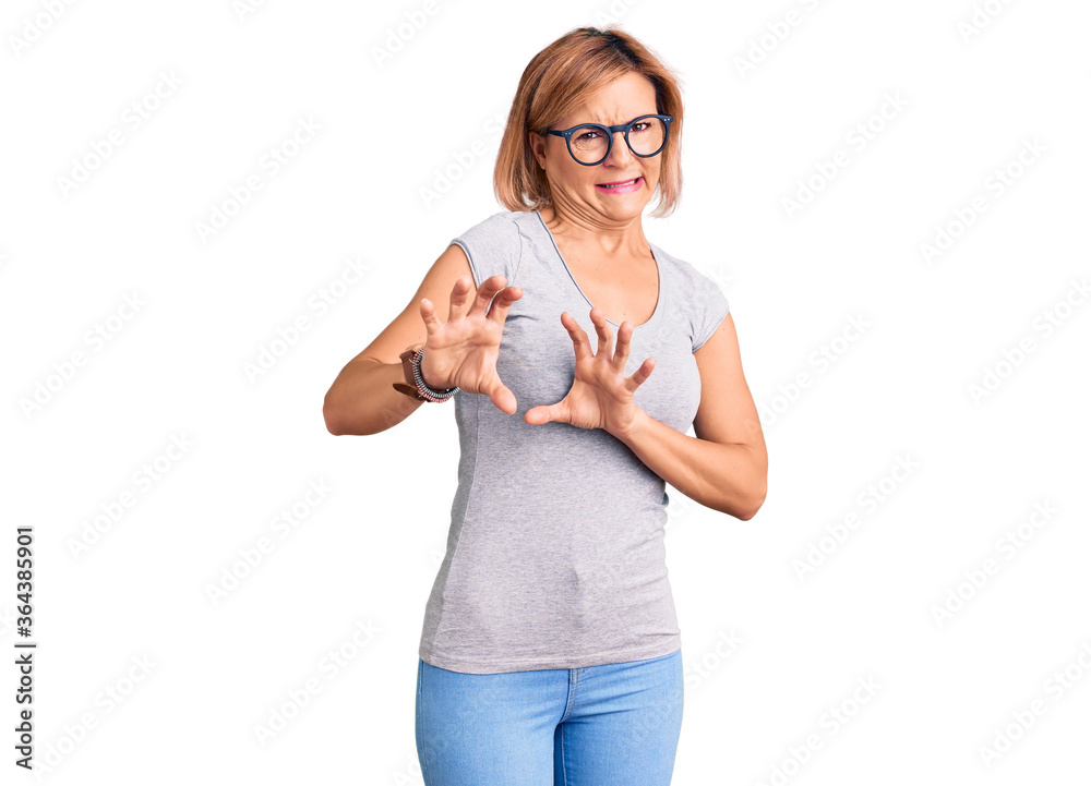 Young blonde woman wearing casual clothes disgusted expression, displeased and fearful doing disgust face because aversion reaction. with hands raised Young blonde woman wearing casual clothes disgusted expression, displeased and fearful doing disgust face because aversion reaction. with hands raised