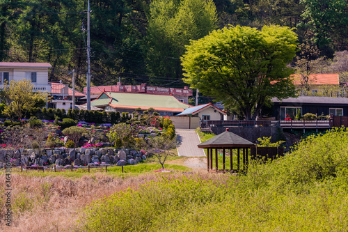 Landscape of a small park with a wooden gazebo