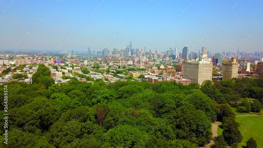 Park Slope in the Foreground New York City in the Background - Descending Crane Shot Park Slope in the Foreground New York City in the Background - Descending Crane Shot