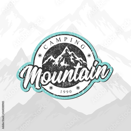 Mountain camping hand drawn vector logo with rocky peaks, lettering and texture isolated on mountain landscape background. Outdoor adventures concept for emblem, packaging, label