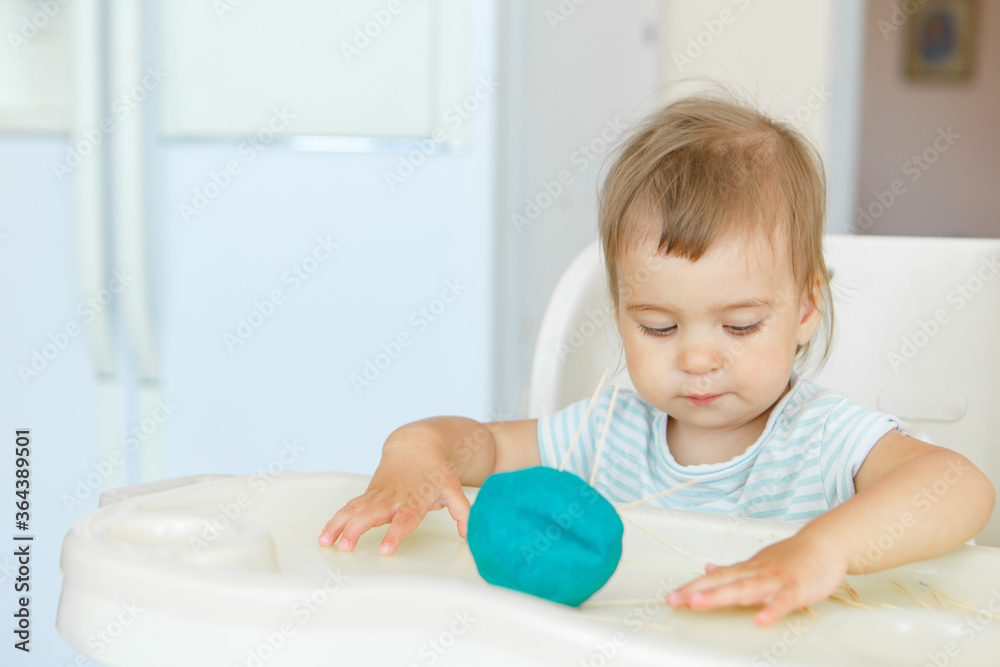 girl sculpts from plasticine. a child makes a hedgehog craft. development of fine motor skills with toothpicks girl sculpts from plasticine. a child makes a hedgehog craft. development of fine motor skills with toothpicks