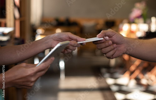 Girl holding credit card and texting