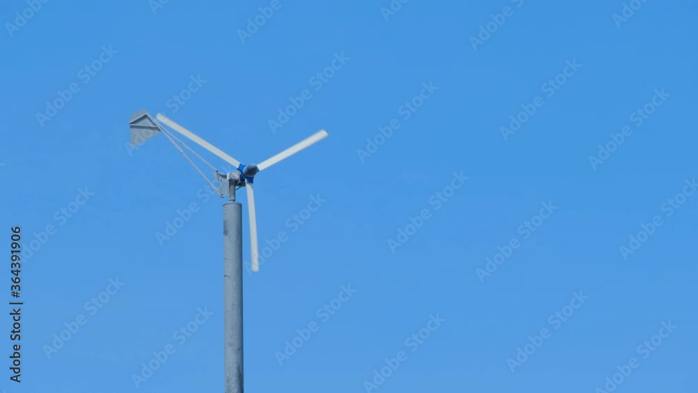 wind turbine on blue sky background