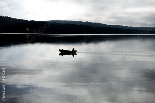 fishing boat on lake